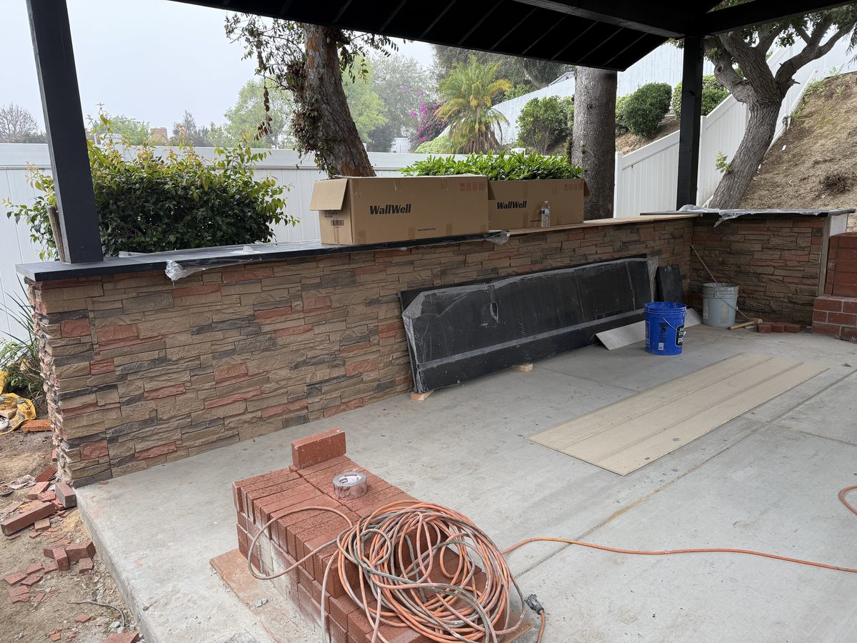 Backyard patio bar clad in Sienna Dawn faux stone panels, Los Angeles